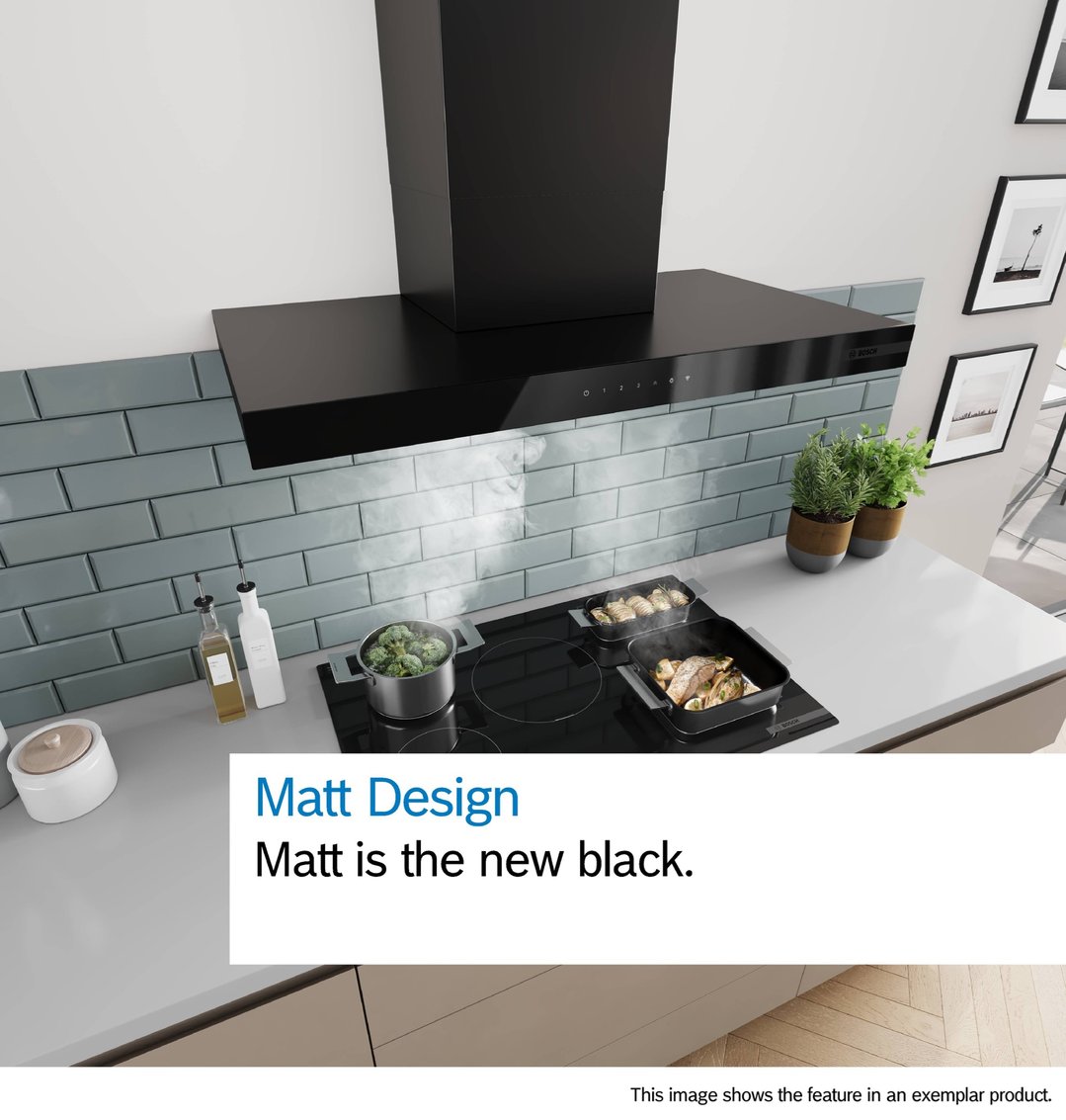 Matte black wall-mounted canopy rangehood above an induction cooktop in a modern kitchen