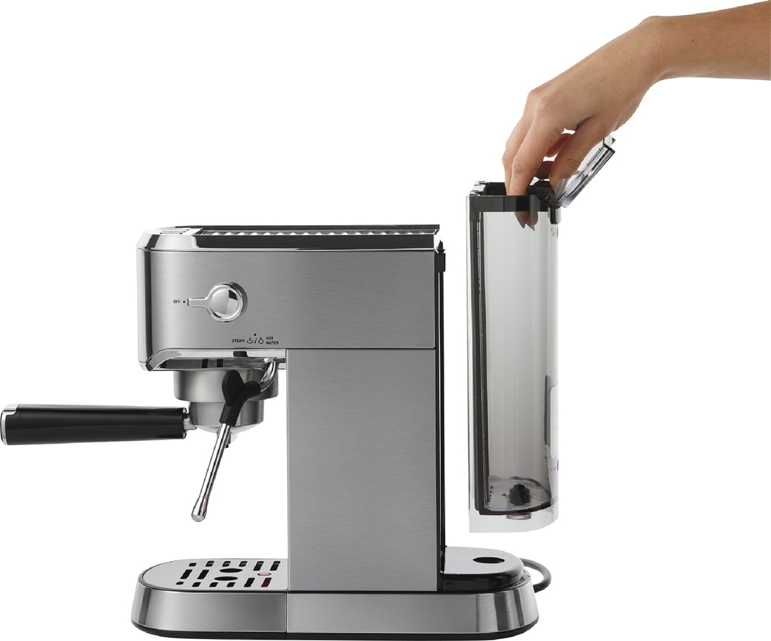 Hand opening the water tank of a stainless steel espresso machine