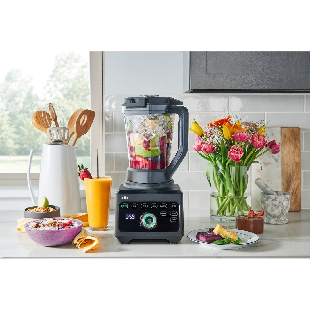 Braun PowerBlend 9 Jug Blender on a kitchen counter with food and flowers
