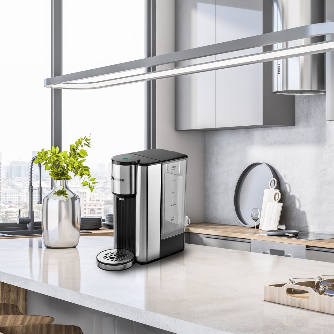 Instant hot water dispenser on a kitchen island in a modern kitchen
