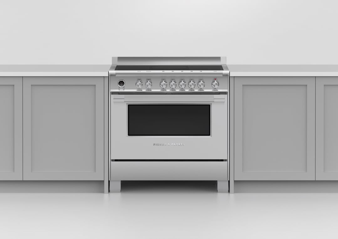 Freestanding induction pyrolytic cooker in a kitchen setting with light grey cabinets