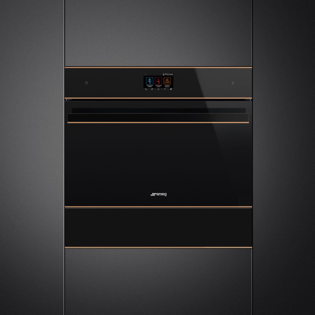 Black blast chiller with copper trim built into dark cabinetry