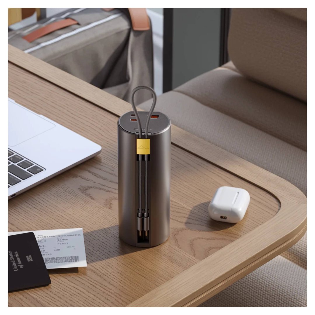 ALOGIC Ark Pro power bank on a wooden table with a laptop