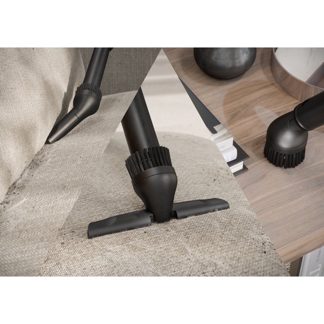 Three vacuum cleaner attachments cleaning different surfaces in a home setting