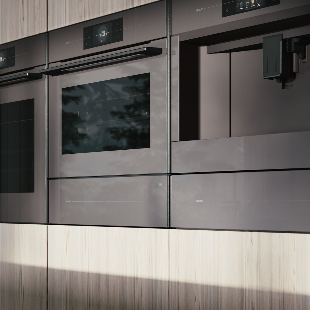 Built-in ovens and coffee machine in a modern kitchen with wooden cabinets