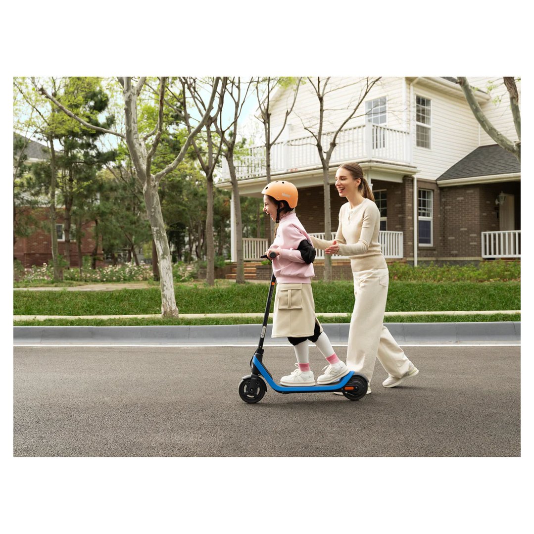 Mother and child riding a C2 Pro Electric KickScooter on a suburban street
