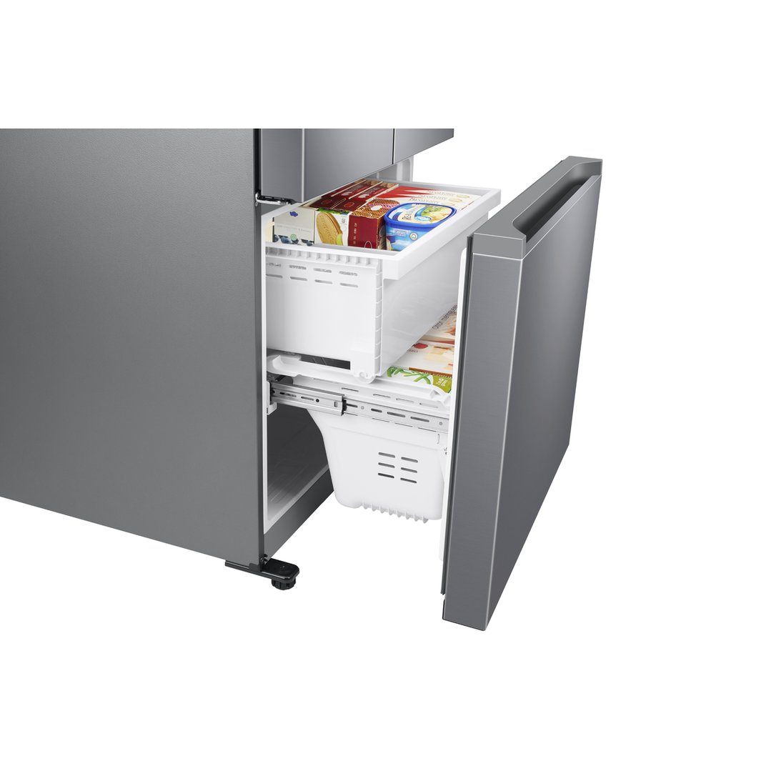 Open bottom drawer of a French Door Refrigerator with food items inside