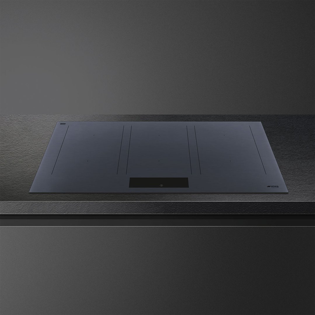 Linea 90cm Multizone Induction Cooktop in Neptune Grey on a dark countertop