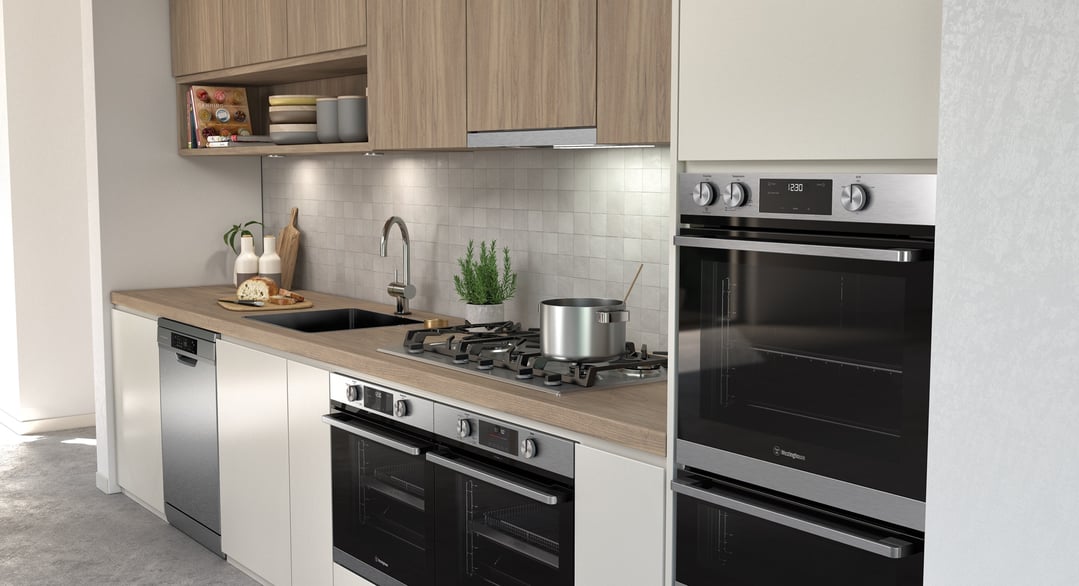 Built-in ovens and cooktop in a modern kitchen with wooden countertops and white cabinets