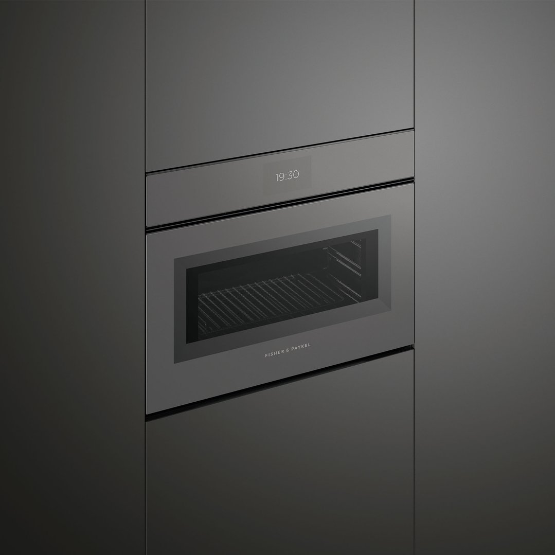Built-in compact combi-microwave oven with a digital display showing 19:30
