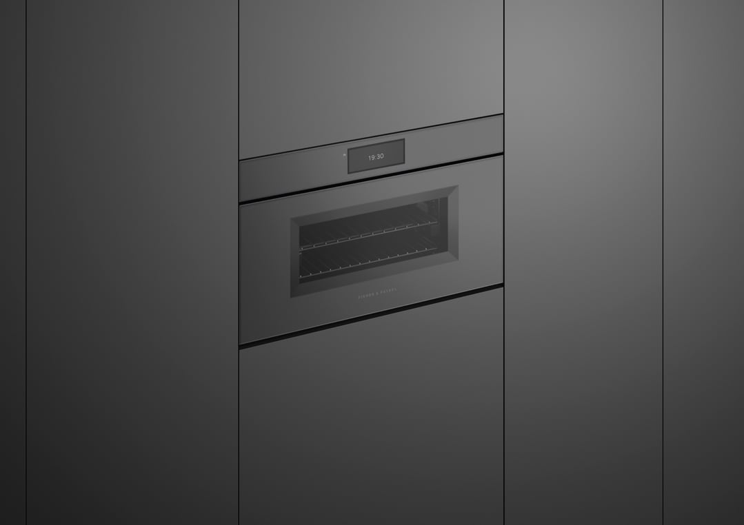 A built-in compact combi-steam oven with a digital display showing 19:30