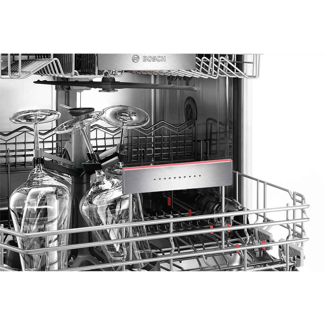Close up of a dishwasher interior with wine glasses on the lower rack
