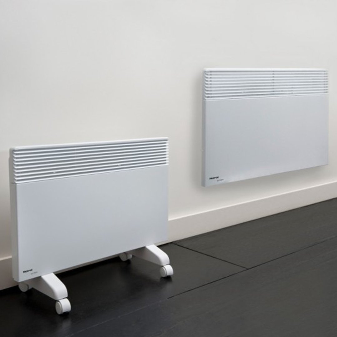 Two white heaters, one on wheels and one wall-mounted, in a room
