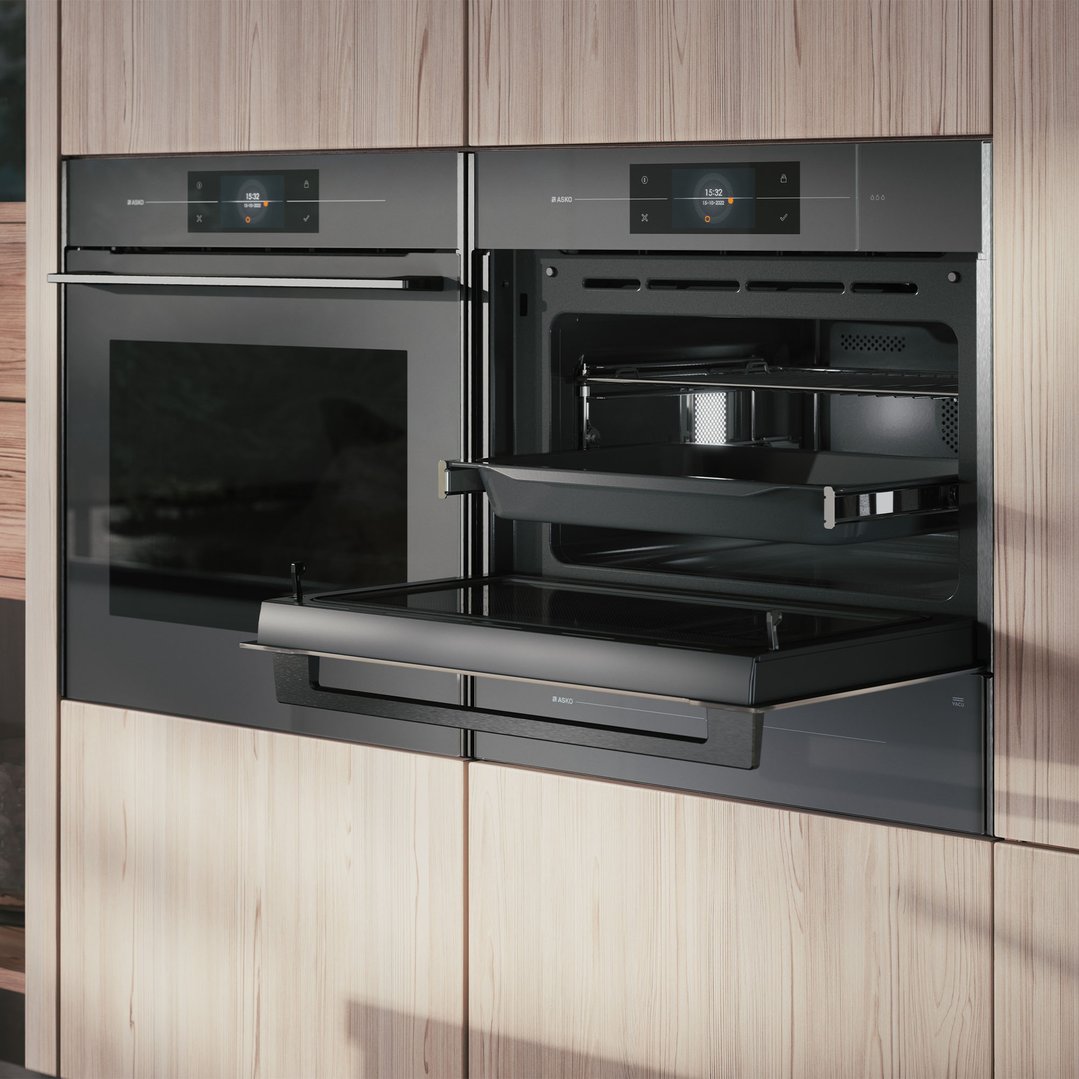 Two ASKO microwave ovens built into light wood cabinetry, one with door open