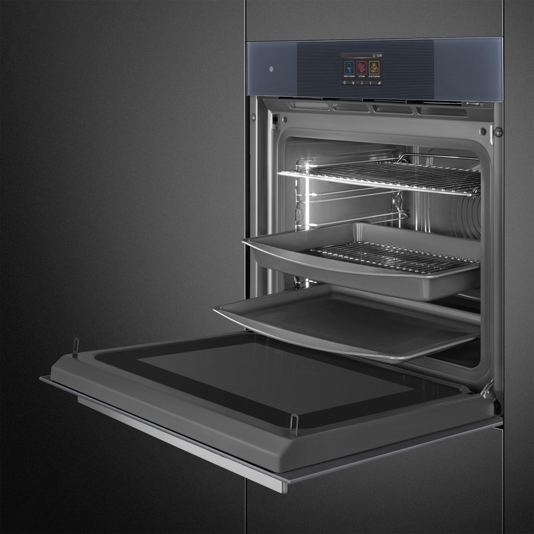 Open SMEG Linea Omnichef oven with racks and trays inside