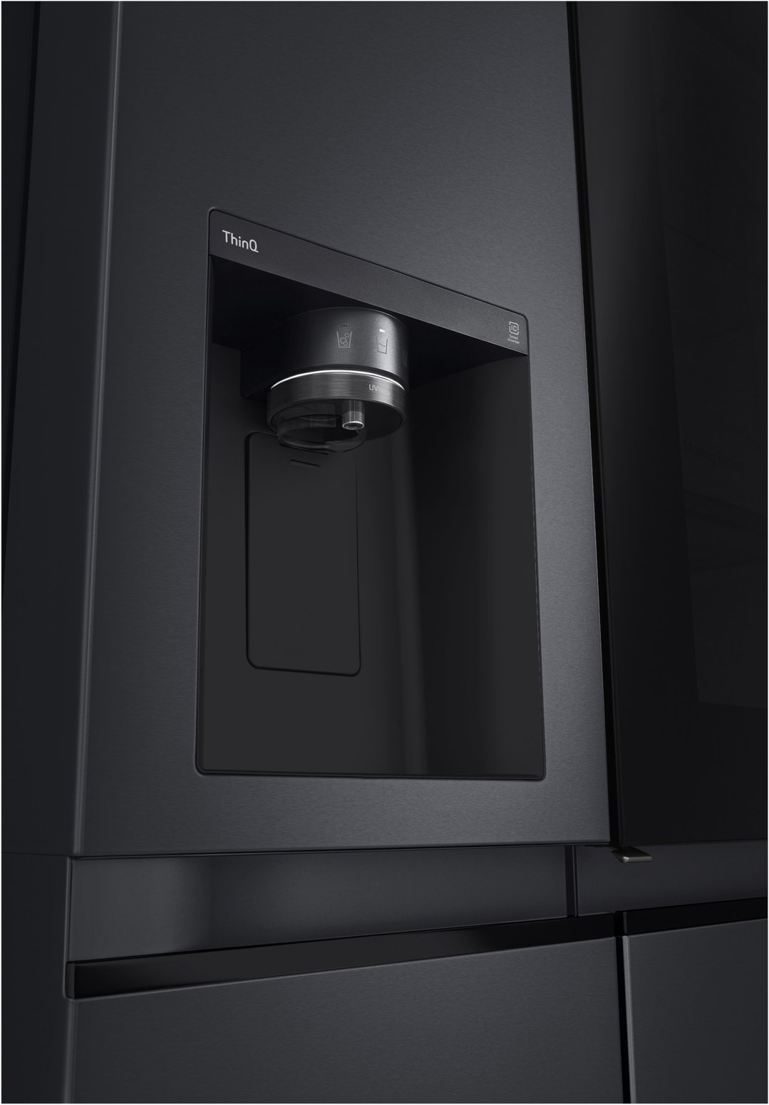 Close up of the matte black side by side fridge water dispenser