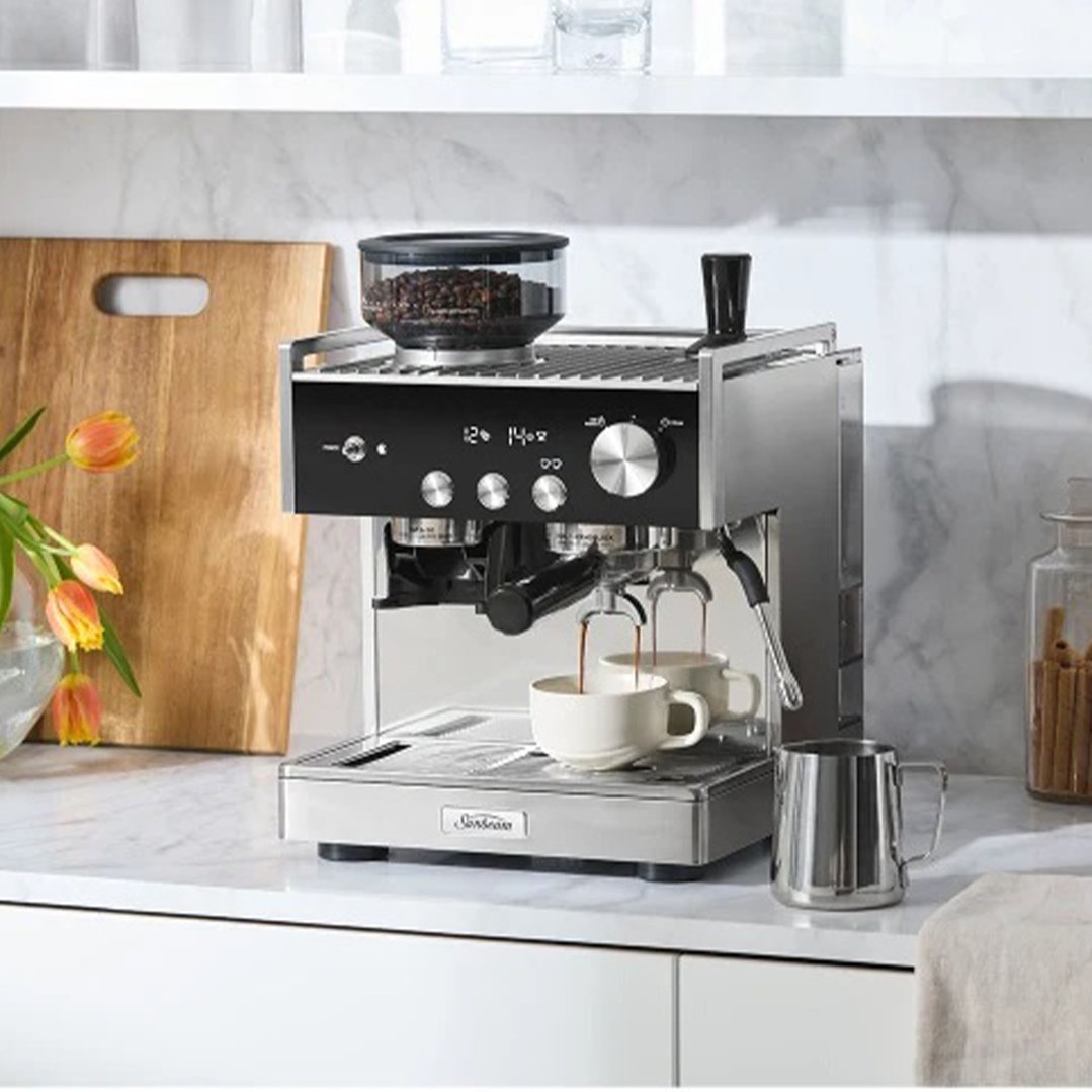 Origins Dual Espresso Coffee Machine making coffee in a kitchen setting