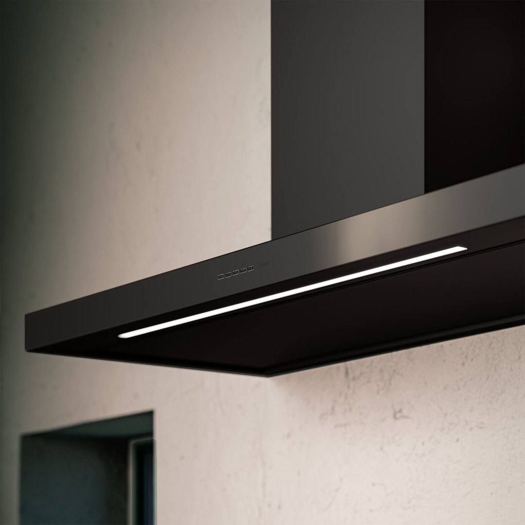 Close-up of a black Falmec rangehood with controls and LED light in a kitchen