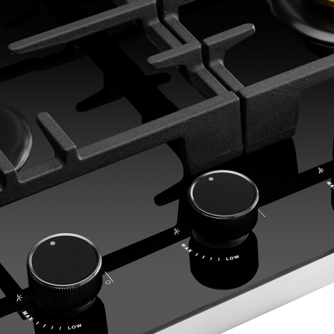 Close up of black gas on glass cooktop with two control knobs