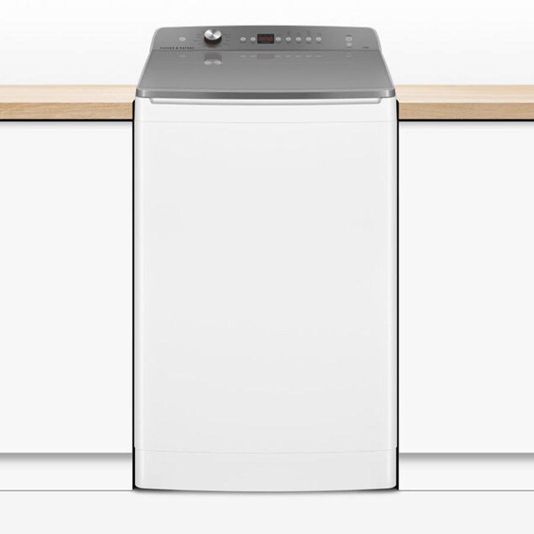 White top loader washing machine with a grey control panel in a kitchen setting