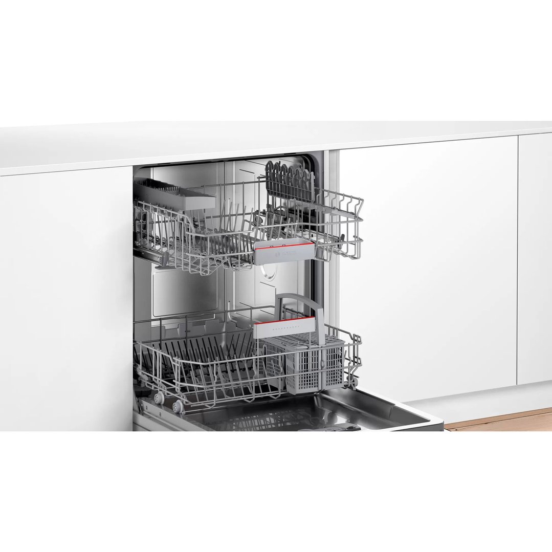 Open fully-integrated dishwasher with two racks pulled out in a modern kitchen