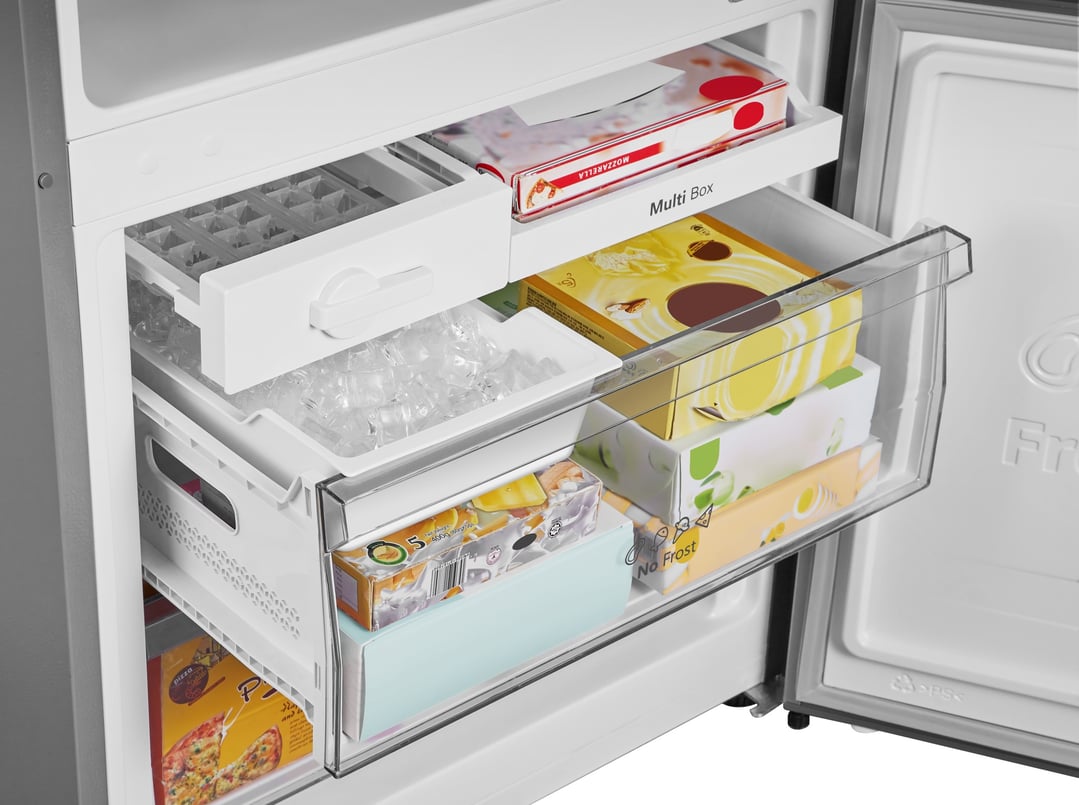 Open freezer compartment of a bottom mount fridge with food items