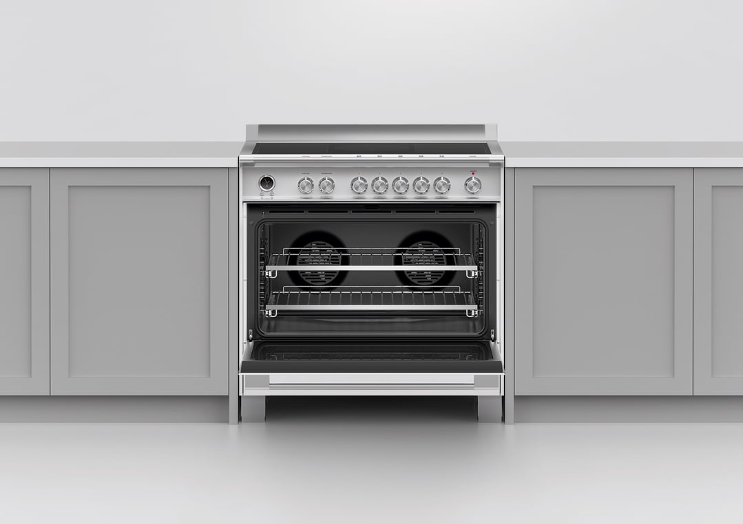 A stainless steel cooker with an open oven door in a kitchen setting
