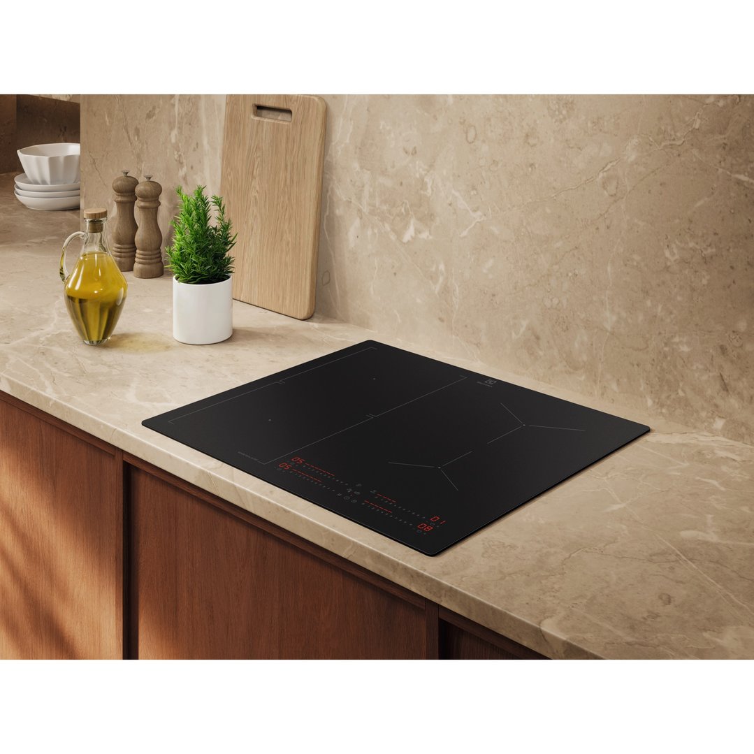 Electrolux 60cm 4 Zone Induction Cooktop in a kitchen with olive oil and plant