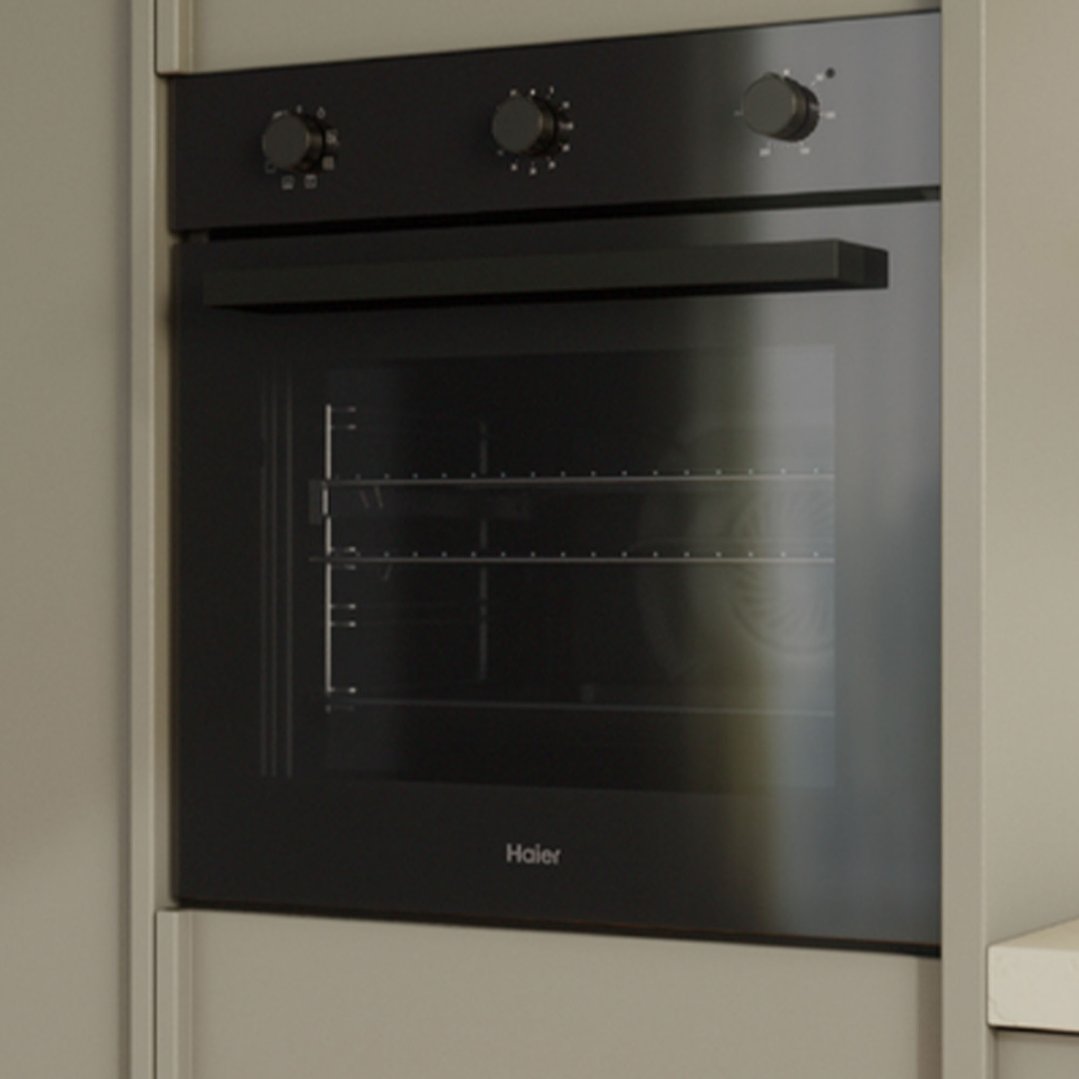 Black built-in oven with three control knobs in a kitchen setting
