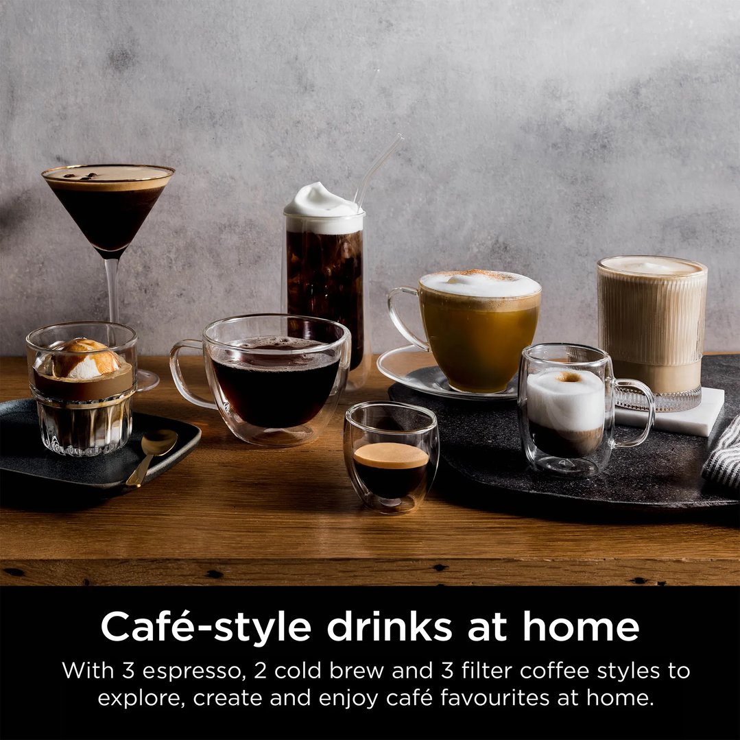 Various coffee drinks in different glasses on a wooden table with a grey background