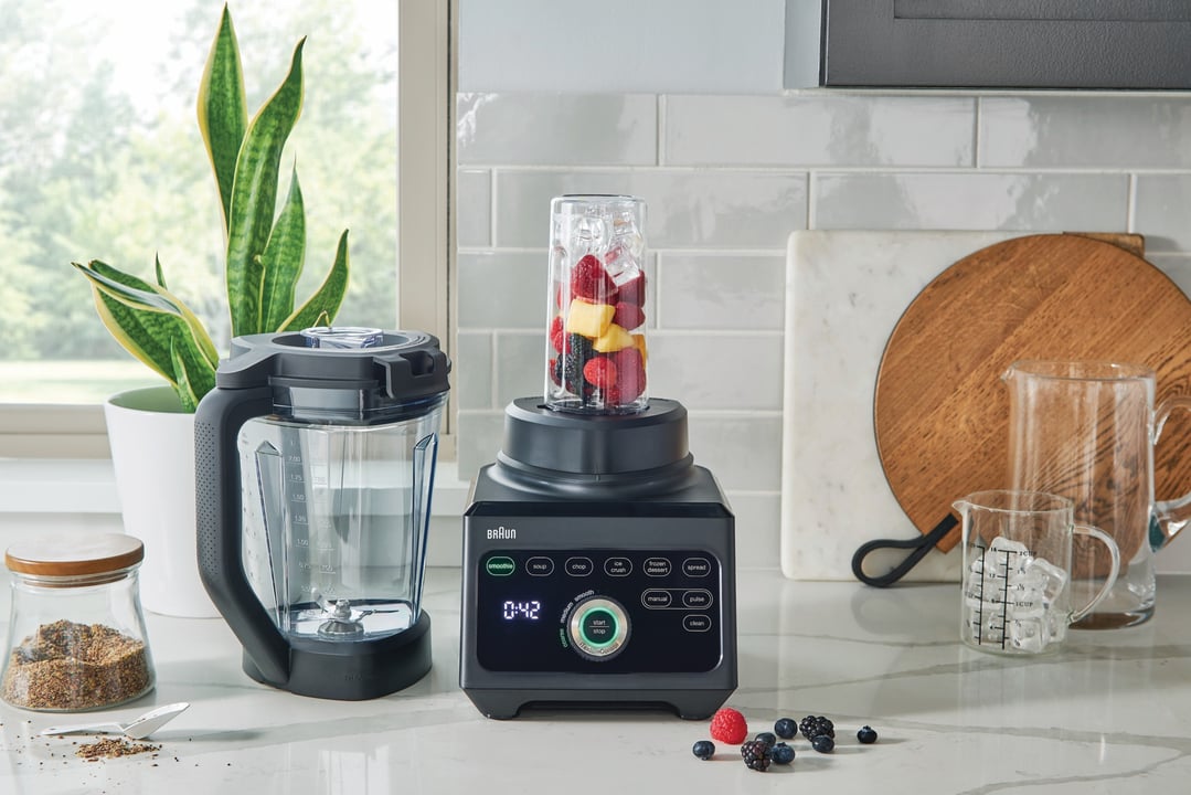 Braun PowerBlend 9 Jug Blender on a kitchen counter with fruit and plant