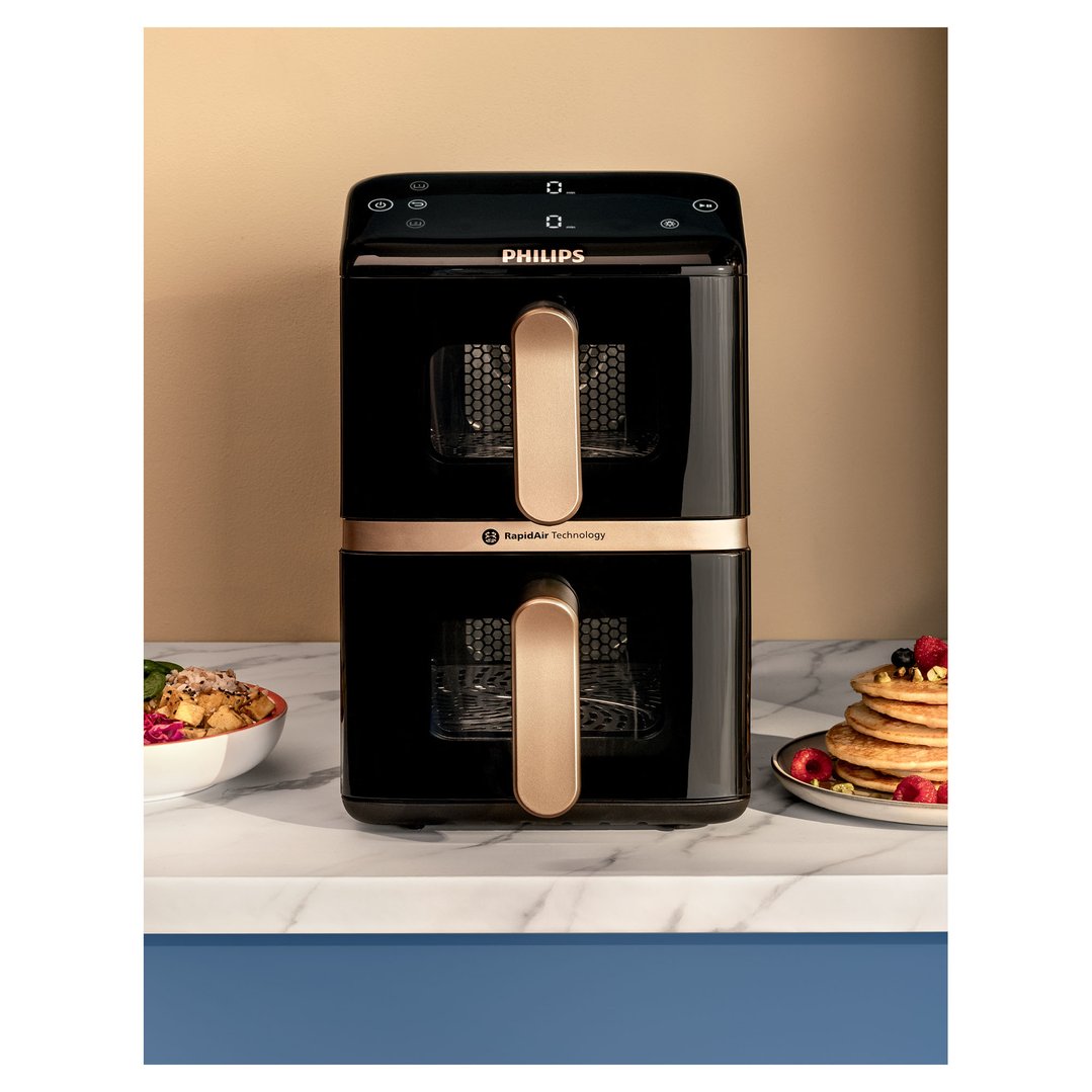 Black Philips Airfryer 4000 Series Stacked Dual Basket on a marble countertop