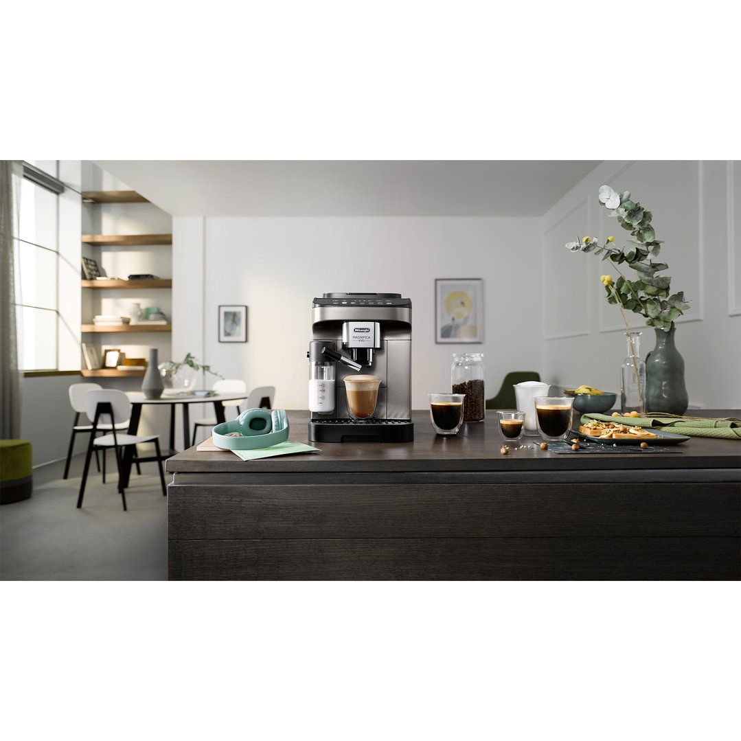 Magnifica Evo coffee machine on a kitchen island with coffee and breakfast