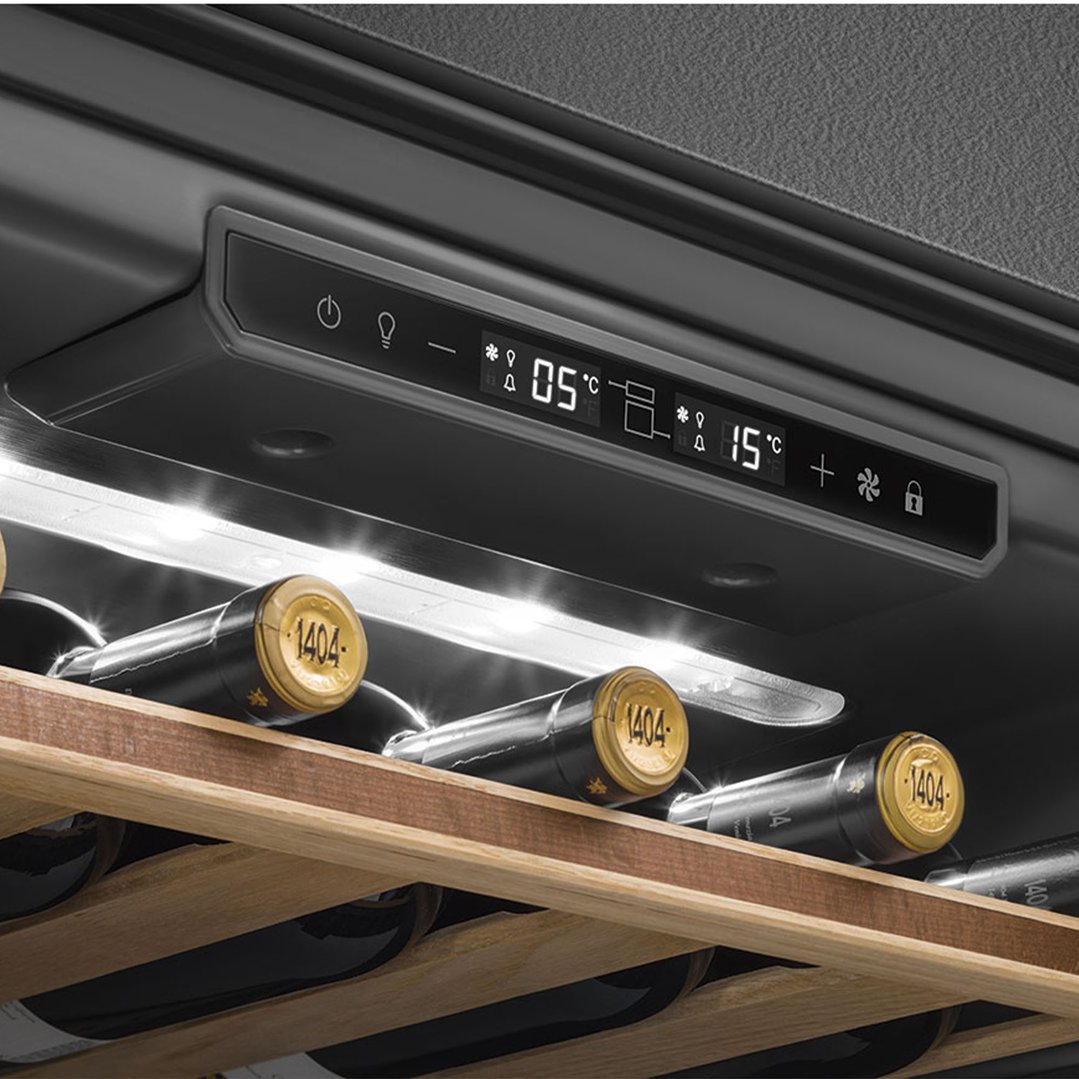 Close up of a wine cellar's control panel and wine bottles