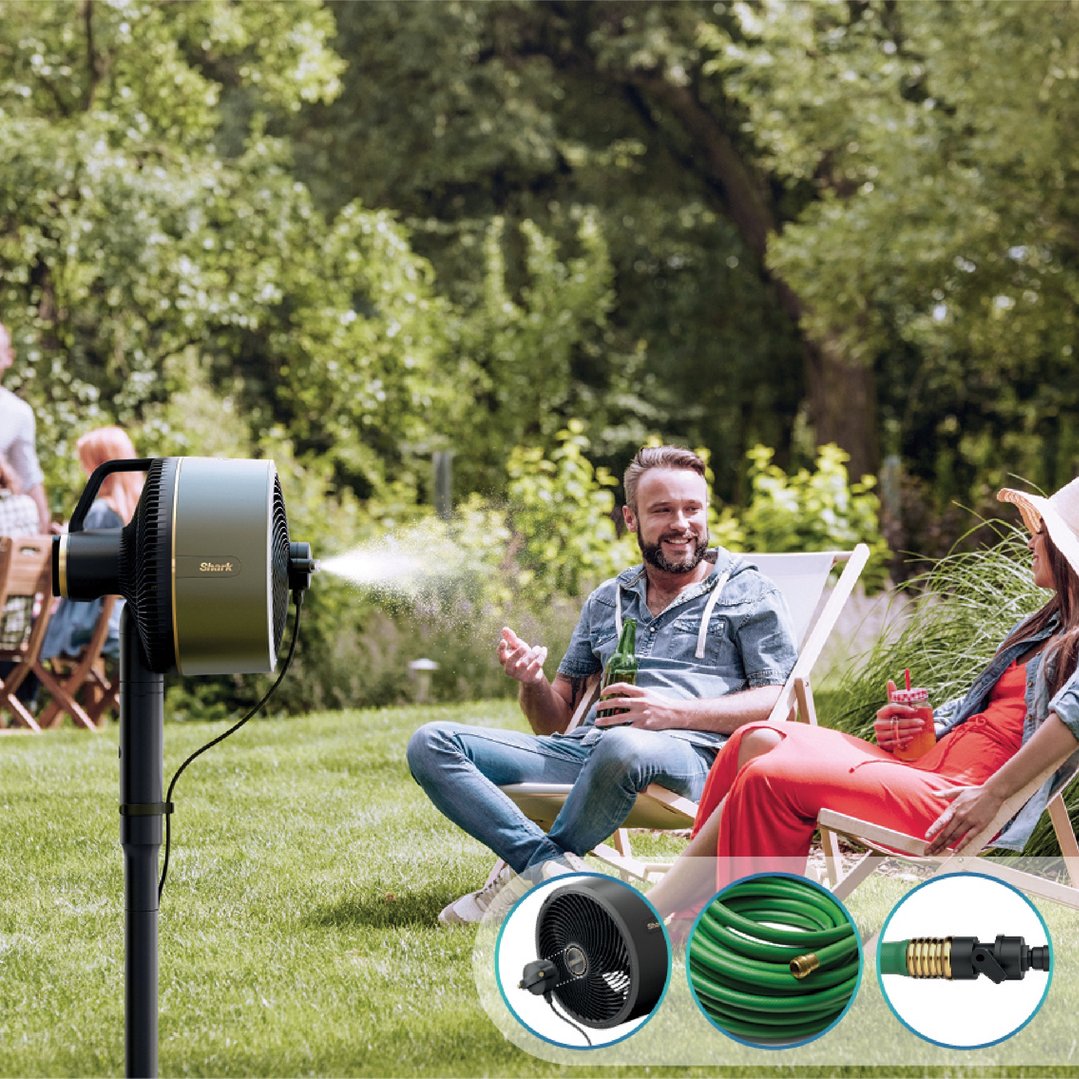 A Shark FlexBreeze fan with misting attachment cooling people relaxing in a garden