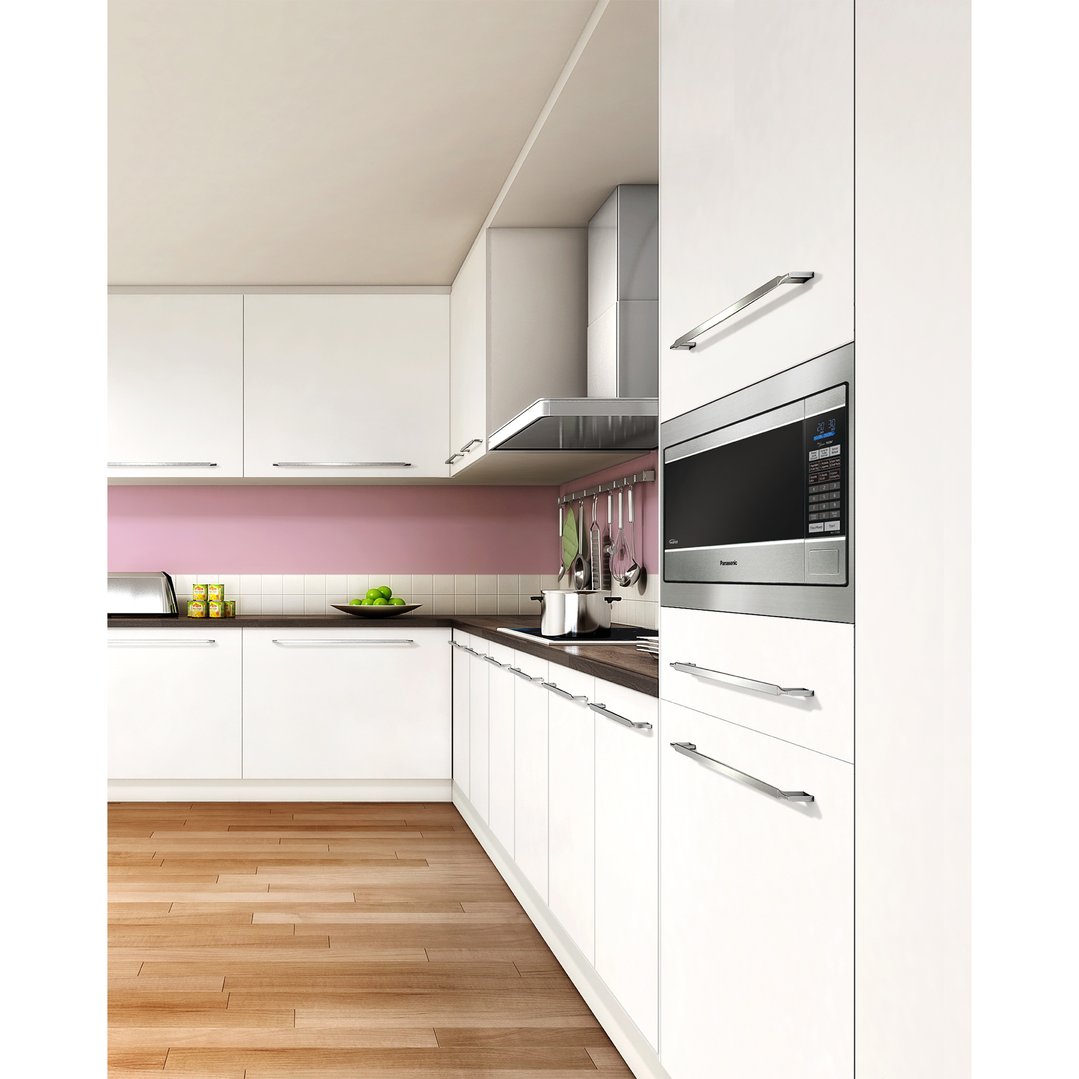 Built-in microwave in a modern kitchen with white cabinets and wood floor