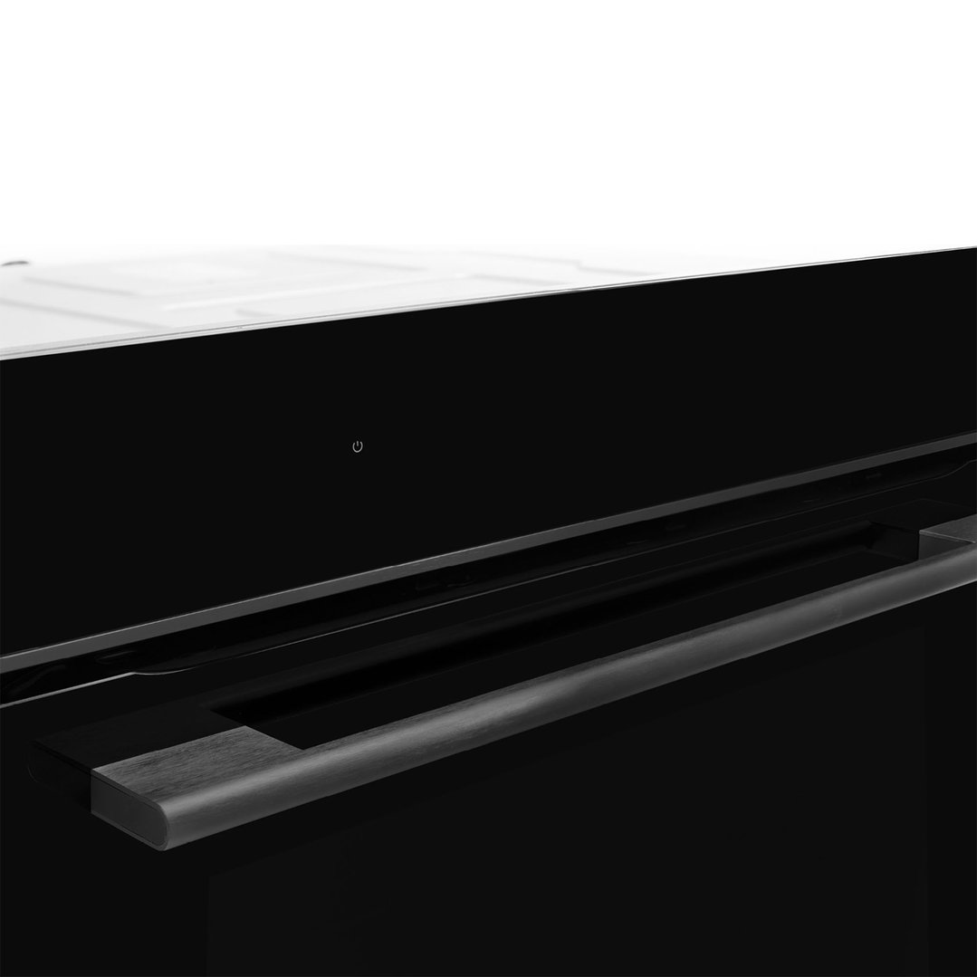 Close-up of a black oven with a dark grey handle and a power button