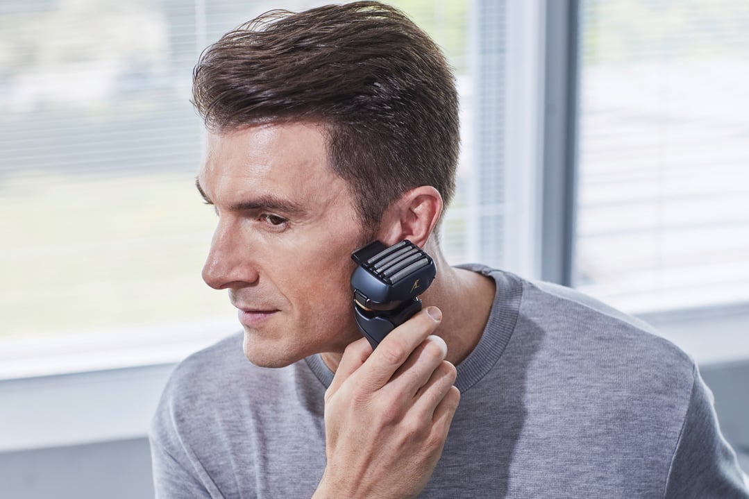 Man shaving his face with a Panasonic Multi-Flex 5-Blade Rechargeable Shaver