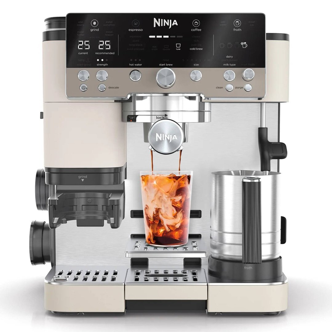 Ninja Luxe Café Premier Espresso Machine dispensing coffee into a glass with ice