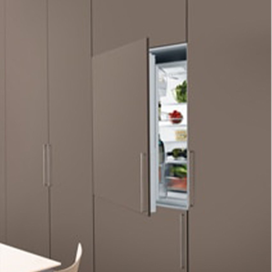 Built-in refrigerator with an open door showing food inside, integrated into cabinetry