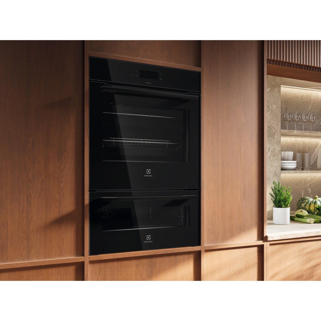 Built-in Electrolux double oven in a modern kitchen with wooden cabinetry