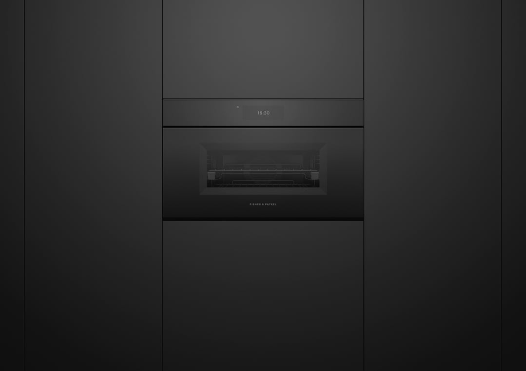 Black Fisher & Paykel Combi-Steam Oven built into dark kitchen cabinetry