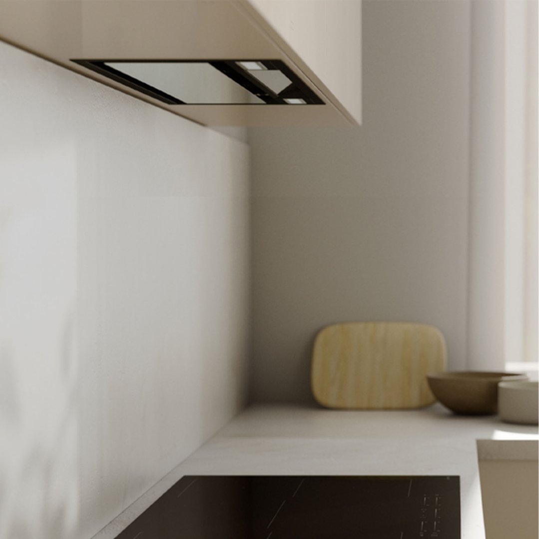 Integrated rangehood above a cooktop in a modern kitchen setting