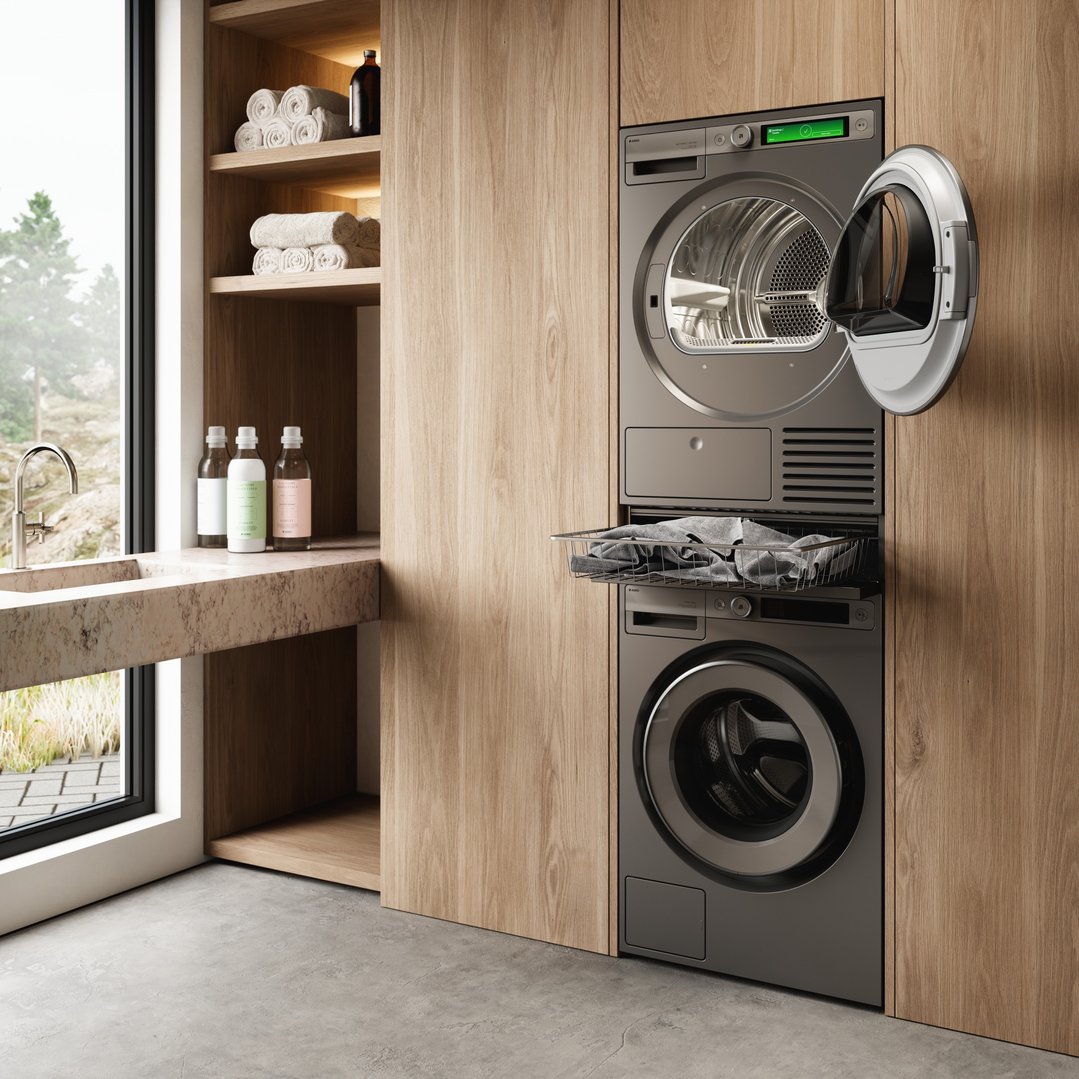 Pull-out basket for laundry in a laundry room with a washer and dryer