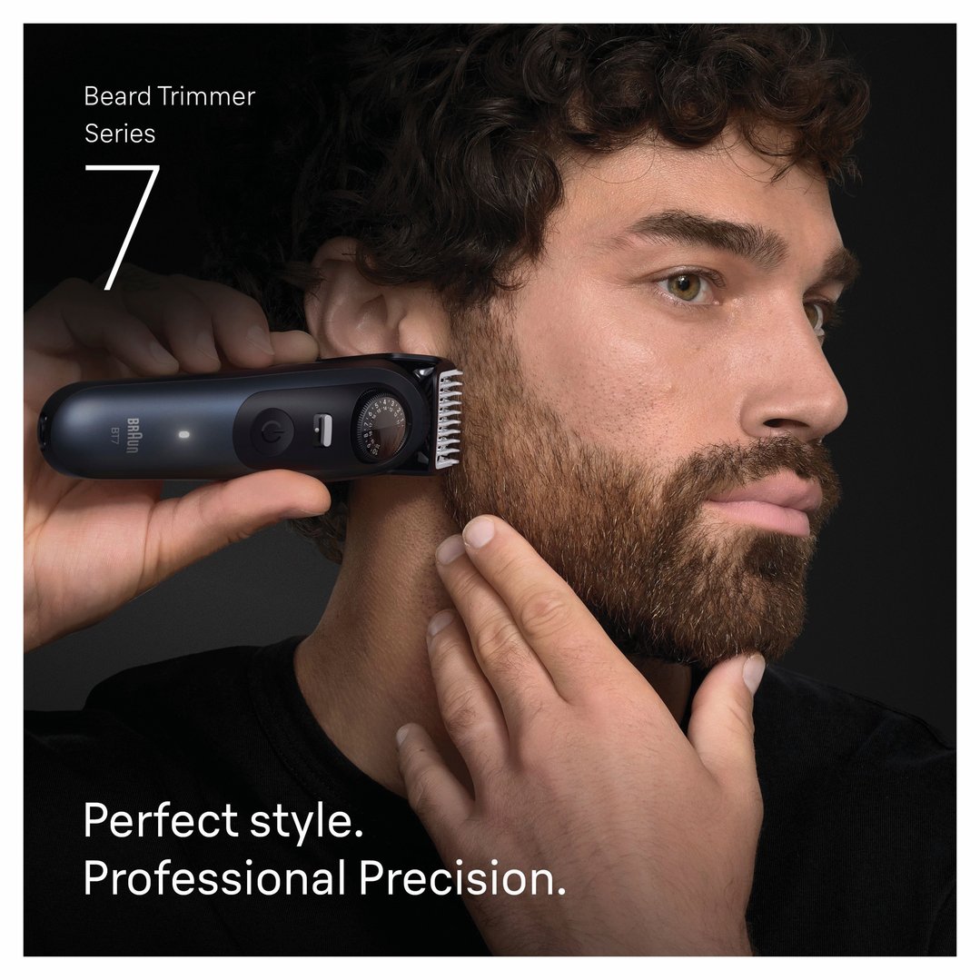 Man using a Braun Series 7 beard trimmer on his beard