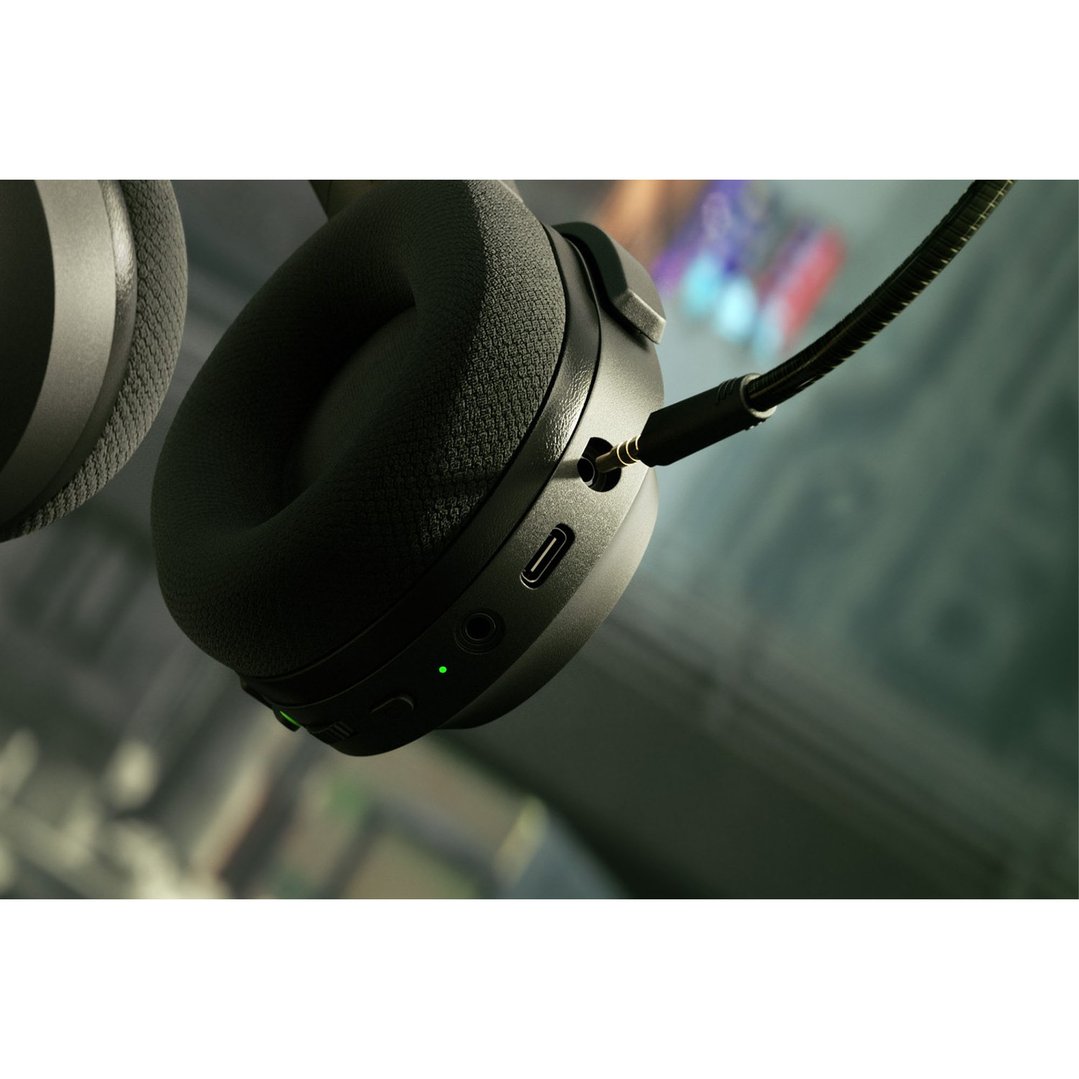 Close-up of a black Barracuda X Wireless Headset with a connected microphone