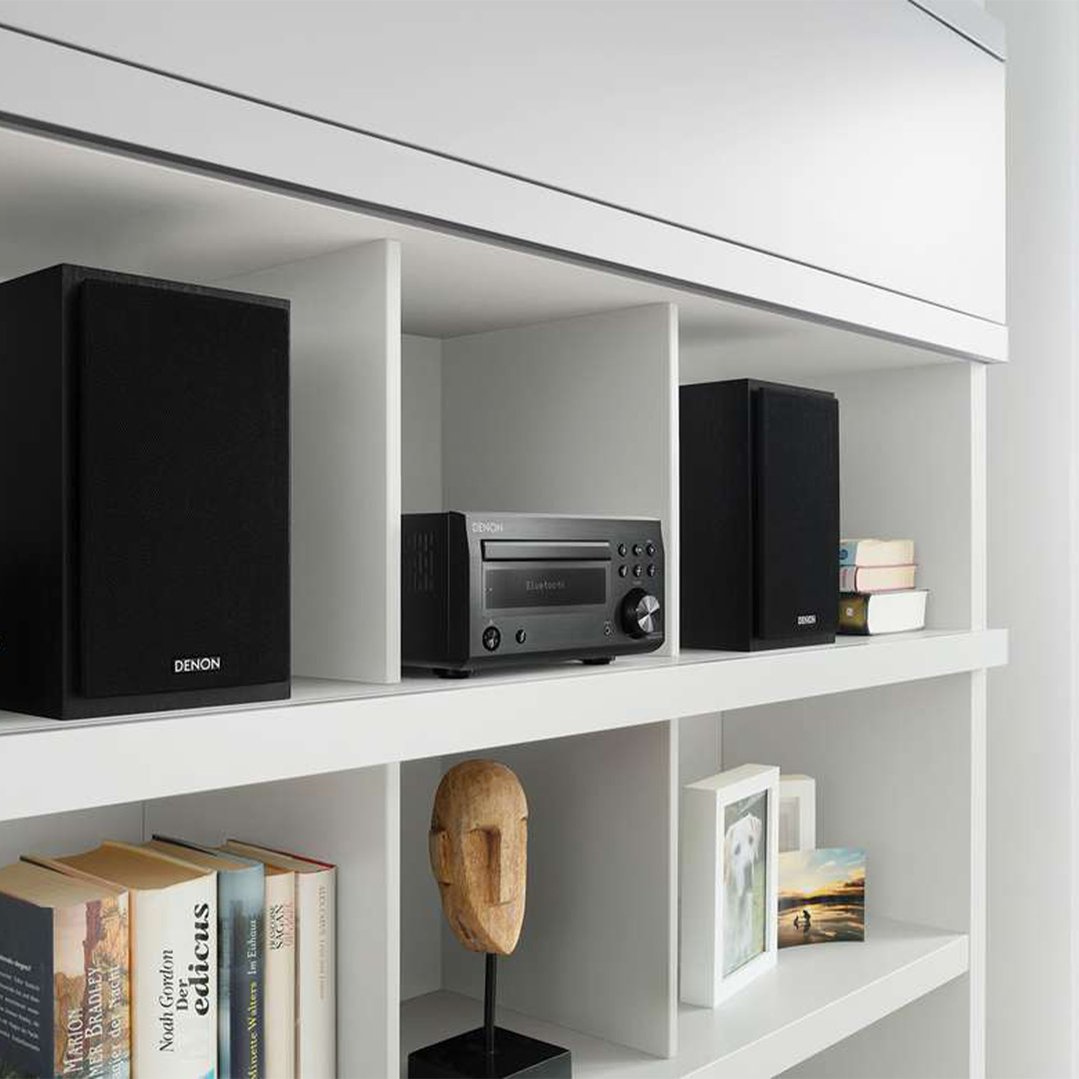 Denon Hi-Fi system with CD and Bluetooth on a white shelf with books and decor
