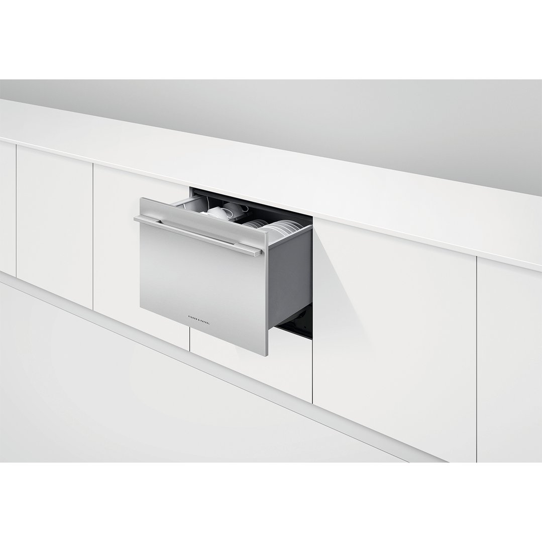 Stainless steel DishDrawer dishwasher partially open in a modern white kitchen
