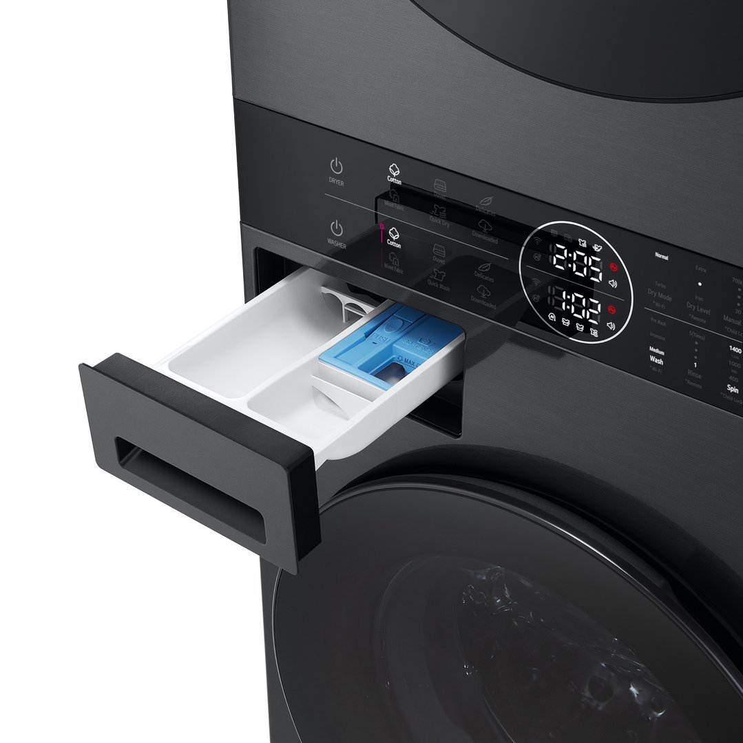 Close-up of a black LG WashTower™ stacked washer dryer with dispenser drawer open