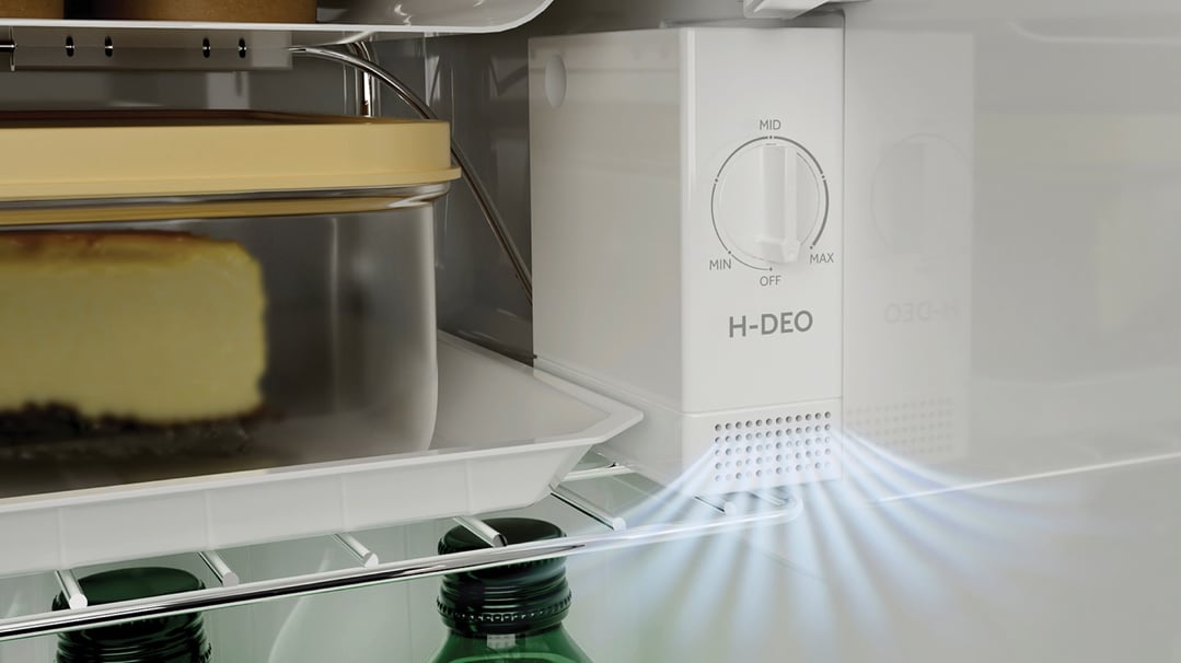 Close up of the H-DEO deodorizer inside a Haier refrigerator with cheesecake